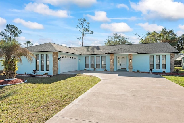 ranch-style house featuring a front yard and a garage