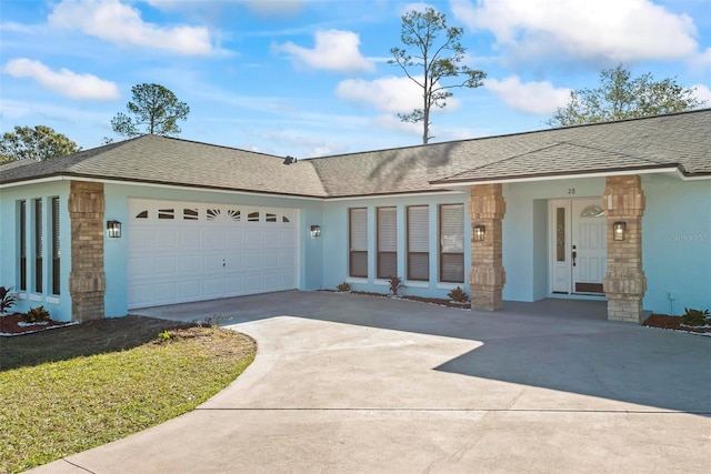 ranch-style home featuring a garage