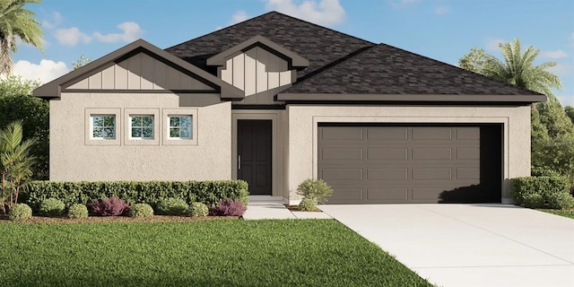 view of front of house featuring a front yard and a garage