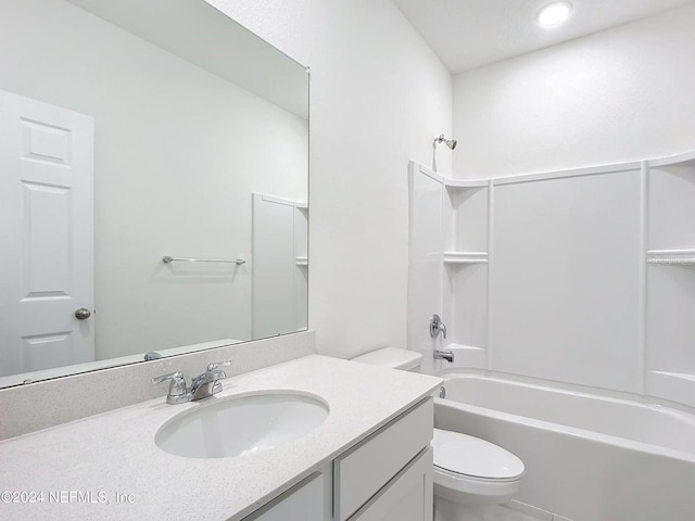 full bathroom with bathing tub / shower combination, vanity, and toilet