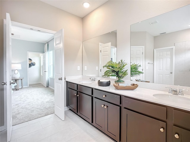 bathroom featuring tile patterned flooring and vanity