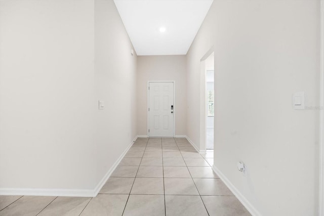 hallway featuring light tile patterned floors