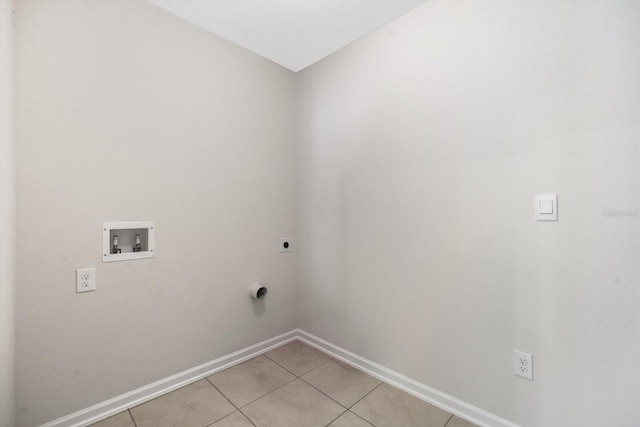 clothes washing area featuring hookup for a washing machine, light tile patterned floors, and electric dryer hookup