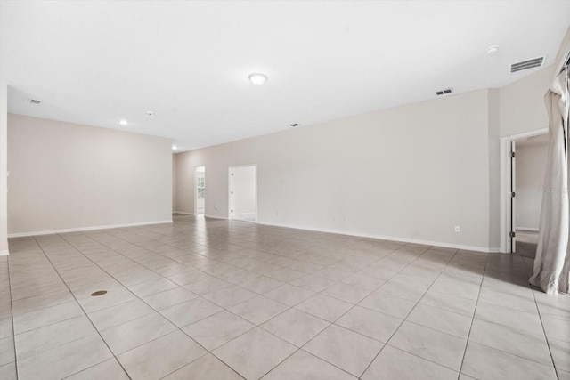 spare room featuring light tile patterned floors