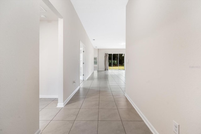 hallway featuring light tile patterned floors