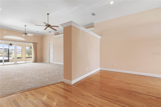 empty room with crown molding, light hardwood / wood-style flooring, and ceiling fan