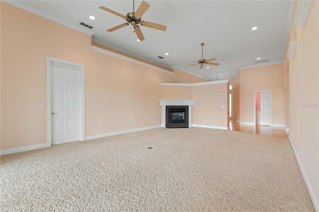 unfurnished living room featuring ceiling fan, light colored carpet, and crown molding