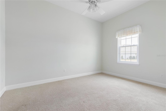 unfurnished room featuring carpet floors and ceiling fan