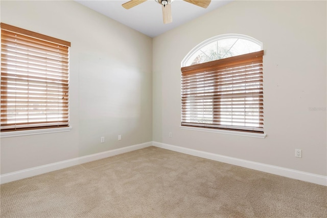 empty room with light carpet and ceiling fan