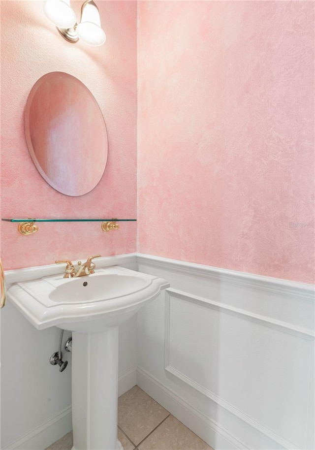 bathroom with tile patterned floors