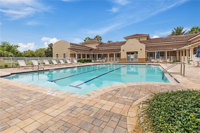 view of swimming pool with a patio