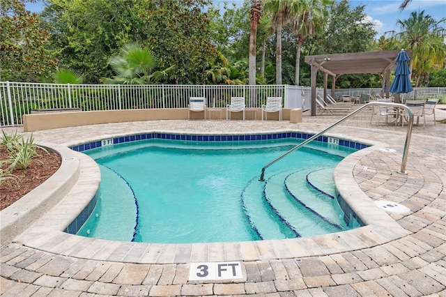 view of pool with a patio area and a pergola