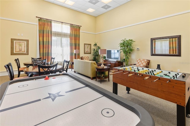 game room with carpet and a paneled ceiling