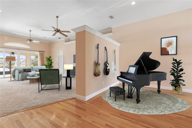 miscellaneous room with light hardwood / wood-style floors, ceiling fan, and ornamental molding