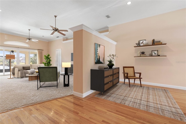 interior space featuring hardwood / wood-style floors, ceiling fan, and ornamental molding