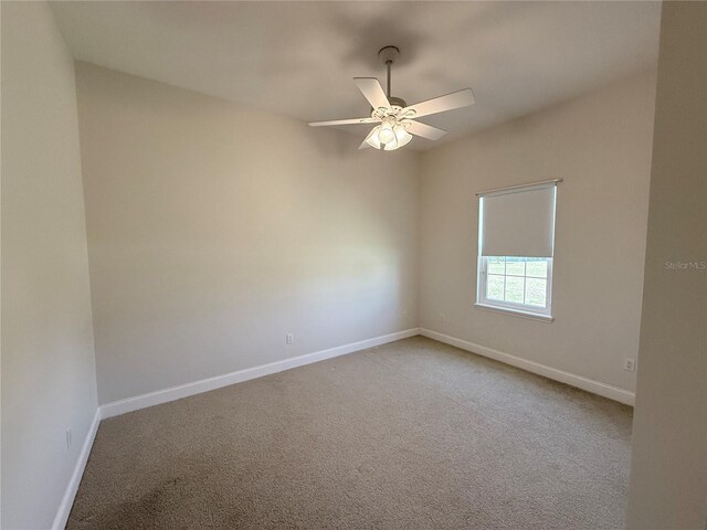 88 Longview Way N, Palm Coast, FL 32137 - empty room featuring baseboards, light carpet, and a ceiling fan