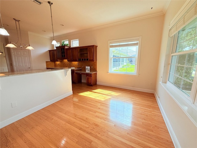 88 Longview Way N, Palm Coast, FL 32137 - unfurnished living room featuring light wood-type flooring, crown molding, and baseboards