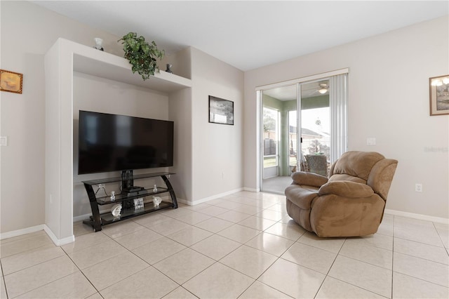 54 Fieldstone Ln, Palm Coast, FL 32137 - living room featuring light tile patterned flooring and baseboards