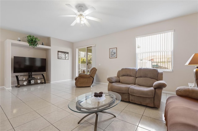 tiled living room featuring ceiling fan