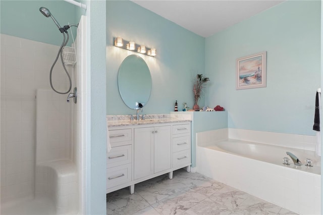 bathroom featuring vanity and independent shower and bath