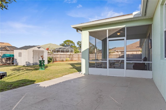 view of patio / terrace featuring a sunroom and a storage shed