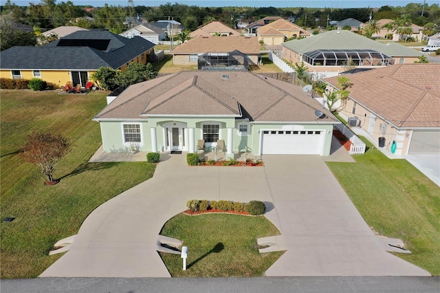54 Fieldstone Ln, Palm Coast, FL 32137 - view of front of home featuring concrete driveway, a residential view, a garage, and a front lawn