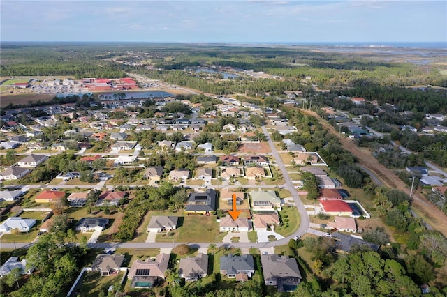 54 Fieldstone Ln, Palm Coast, FL 32137 - aerial view of property's location with a forest and nearby suburban area