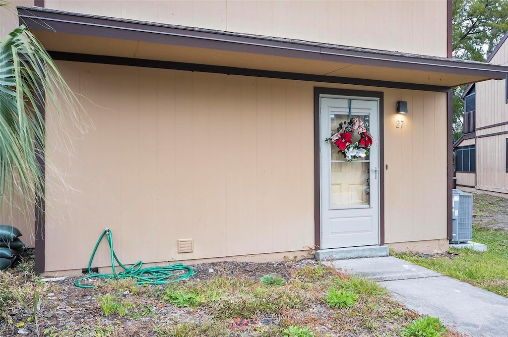 view of exterior entry featuring cooling unit