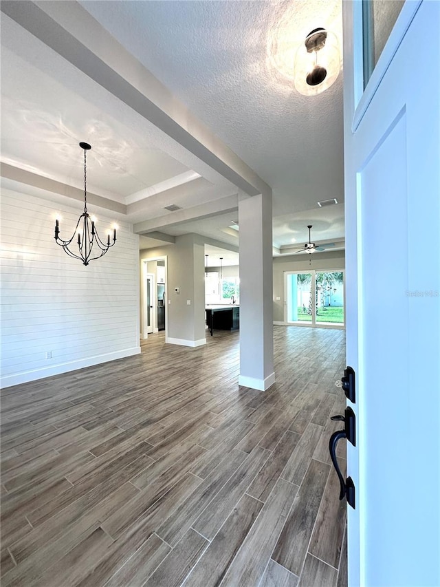 36 Armand Beach Dr, Palm Coast, FL 32137 - entryway with dark wood-style flooring, a chandelier, ceiling fan, and a tray ceiling