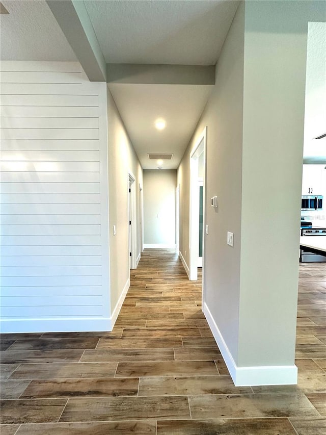 36 Armand Beach Dr, Palm Coast, FL 32137 - hallway with wood finished floors and a textured ceiling