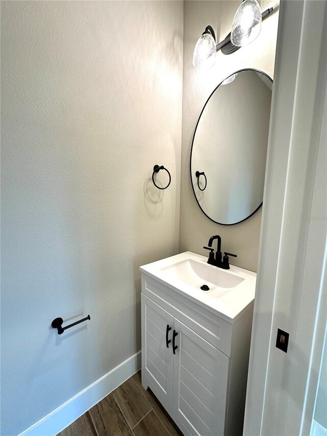 36 Armand Beach Dr, Palm Coast, FL 32137 - bathroom featuring vanity and wood finished floors