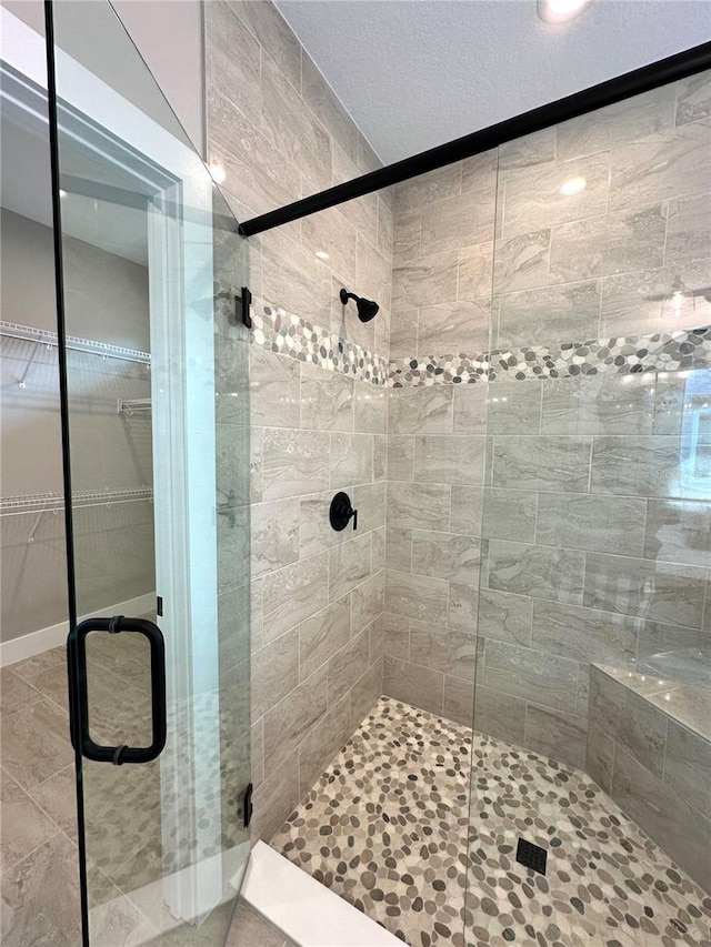 36 Armand Beach Dr, Palm Coast, FL 32137 - bathroom with a shower stall, a walk in closet, and tile patterned flooring