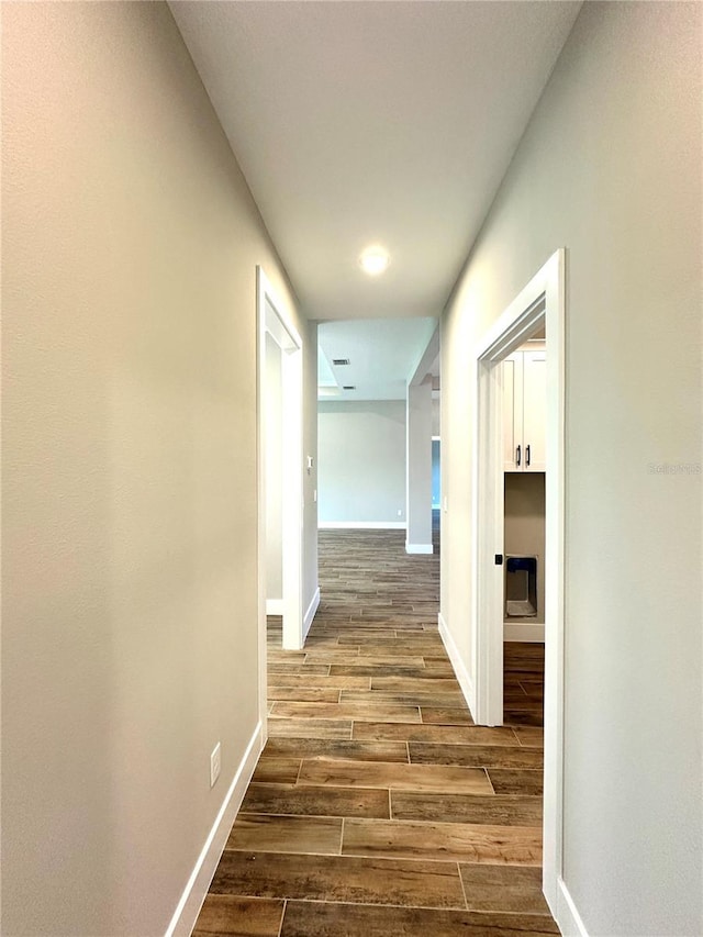 36 Armand Beach Dr, Palm Coast, FL 32137 - hall featuring dark wood-style floors and baseboards