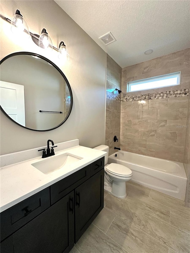 36 Armand Beach Dr, Palm Coast, FL 32137 - bathroom featuring vanity, a textured ceiling, and shower / tub combination