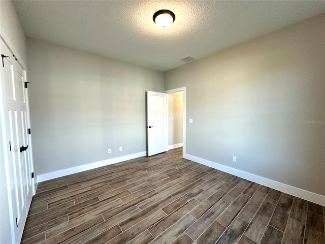 36 Armand Beach Dr, Palm Coast, FL 32137 - empty room with dark wood-type flooring and a textured ceiling