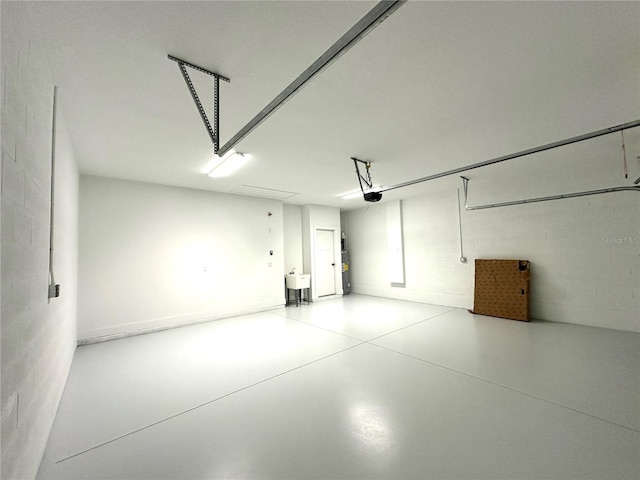 36 Armand Beach Dr, Palm Coast, FL 32137 - garage featuring a garage door opener and concrete block wall