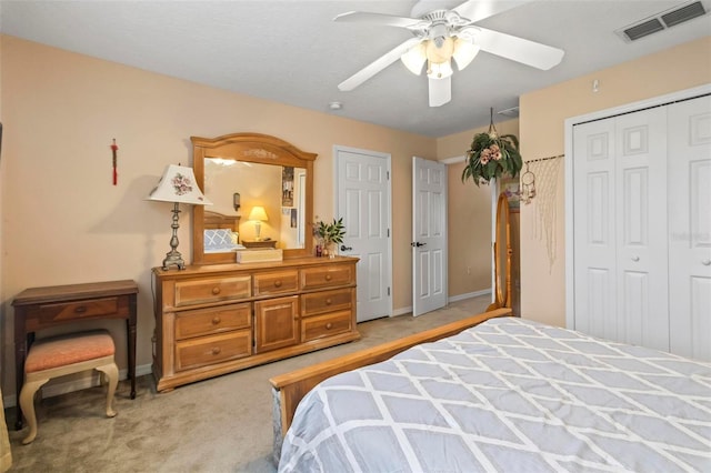 bedroom with ceiling fan and light carpet