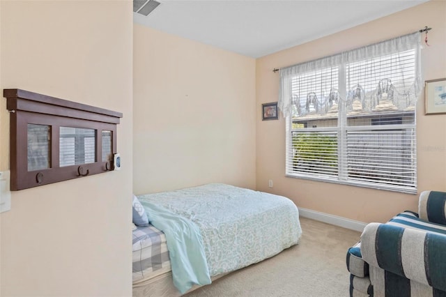 bedroom with light colored carpet