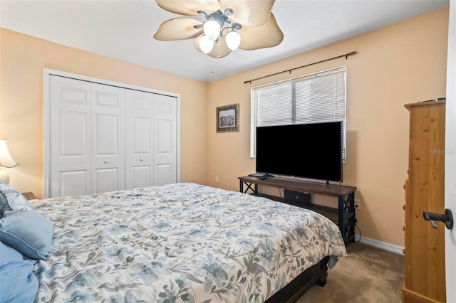 bedroom featuring ceiling fan, a closet, and carpet floors