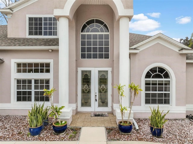 entrance to property featuring french doors