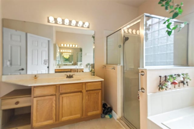 bathroom with vanity, tile patterned flooring, and separate shower and tub