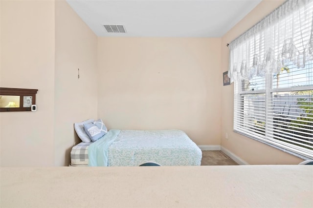 bedroom featuring carpet