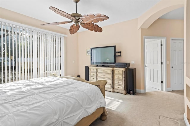 bedroom with ceiling fan and light colored carpet