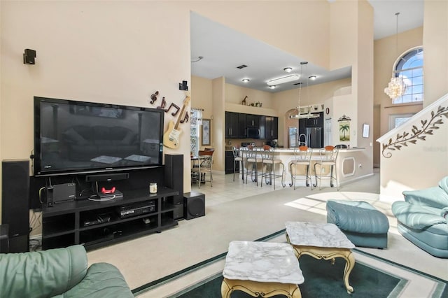 tiled living room featuring a high ceiling