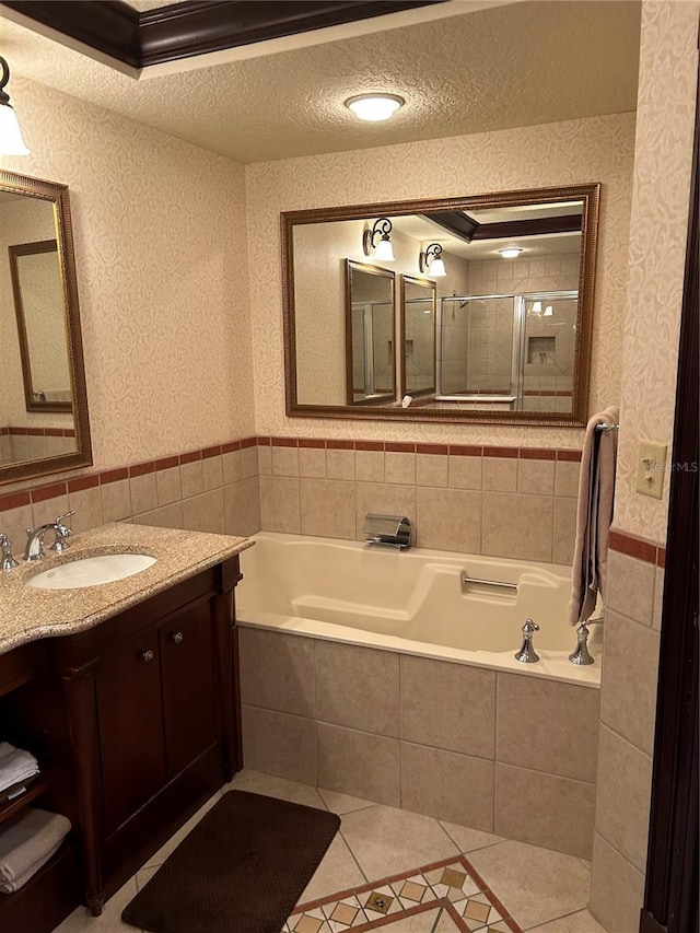 bathroom featuring tile patterned floors, vanity, crown molding, and plus walk in shower