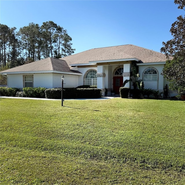 ranch-style home with a front yard