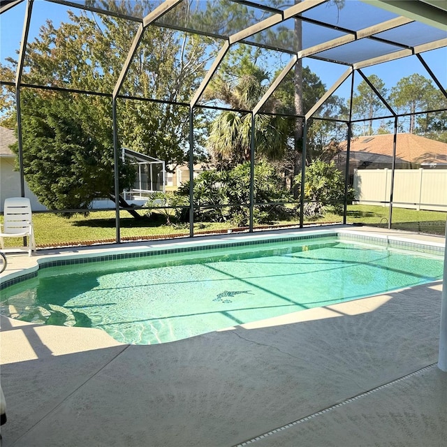 view of swimming pool with a lanai