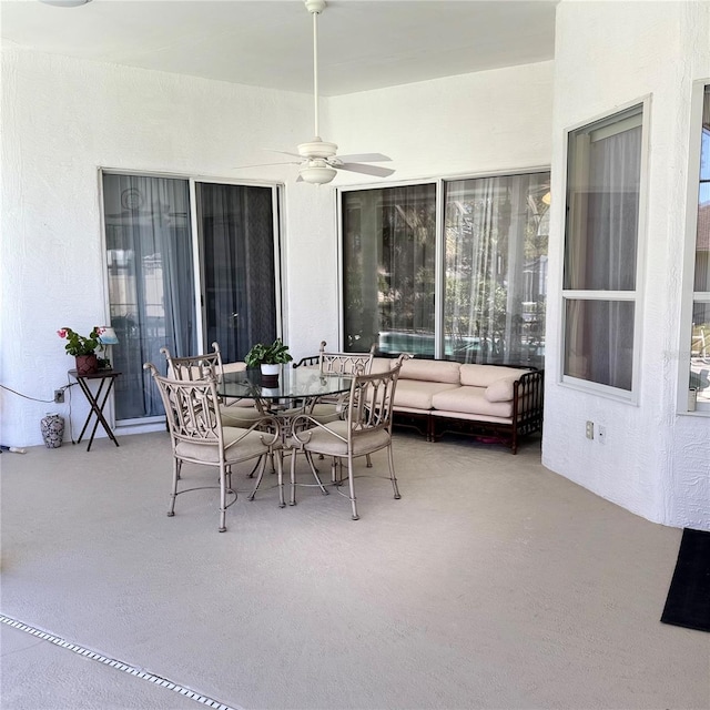 view of patio featuring ceiling fan and an outdoor living space