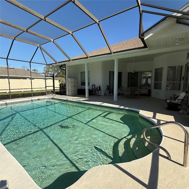 view of pool with a lanai and a patio