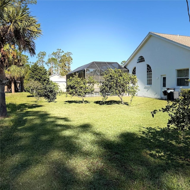 view of yard featuring a lanai